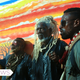 The Bangui Hyenas, plus one desperate drug dealer, stand against a colorful mural.